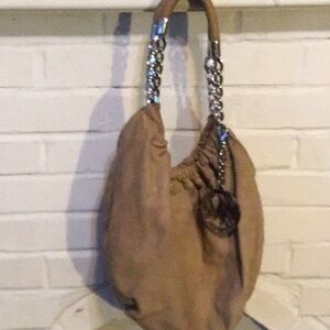 Michael kors brown purse with silver handle and hand tag